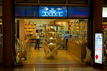 Store selling shark fins and other marine products in an airport in Indonesia. June 2007