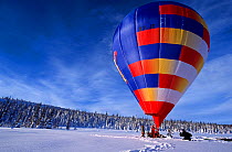 Cameraman in a 'cinebulle' (a hot air balloon adapted for filming) to film the landscape without disturbing the snow, Lapland, Finland for BBC series Planet Earth.