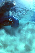 Sandblaster searching and blowing a magnetic hit during the recovery of the shipwreck "Las Maravillas", a Spanish galleon sunk in 1658, Bahamas. 1987, model released