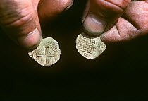 Gold coins recovered from the shipwreck "Las Maravillas", a Spanish galleon sunk in 1658, Bahamas. 1987. model released Model released.
