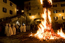 People celebrating with the ceremonial bonfires of Saint Joseph's Night. Such events are held around the vernal equinox, have a clear pagan origin and pay homage to the sun. Pitigliano, Tuscany, Italy...