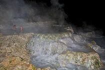 People using a Hot Natural Spa of Saturnia, at night Tuscany, "Maremma", Italy. April 2009