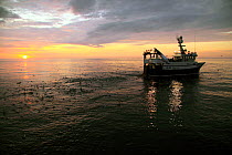 Sunset over trawler on the North Sea, June 2010. Property released.