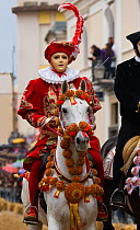 Portrait of a masked rider on a horse (Equus caballus) from the Gremio di Falegnami parades before the start of the 'Sartiglia' (race to the star)  in Oristano, Sardinia, Italy. February 2010