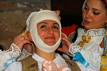 During the dressing of the Gremio di Falegnami, 'Su Cumponidori' the head of the 'Sartiglia' (race to the star) is officially dressed in the traditional costume  in Oristano, Sardinia, Italy. February...