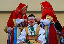 During the 'vestizione' (dressing), 'Su Cumponidoreddu', the head of the 'Sartiglia' (race to the star) is officially dressed in the traditional costume in Oristano, Sardinia, Italy. February 2010