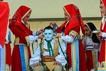 During the 'vestizione' (dressing), 'Su Cumponidoreddu', the head of the 'Sartiglia' (race to the star) is officially dressed in the traditional costume and mask in Oristano, Sardinia, Italy. February...