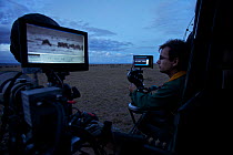 Alex Verner in filming vehicle operating thermal cameras, on location for "Night of the Lion", 2009. Can only be used if National Geographic "Night of the Lion" is mentioned