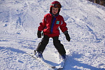 Boy (5 years) downhill skiing, Vermont, USA, Model released