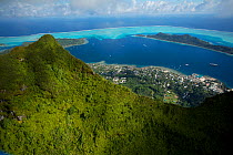 Aerial view volcanic peak and coastal town of Bora Bora Island, Society Islands, French Polynesia. July 2006