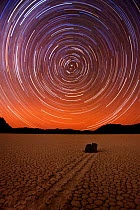 Long exposure to capture star trails circling around the North Star, Polaris, at the "Racetrack," a remote desert playa (dry lake bed) in Death Valley National Park, famous for its mysterious moving r...