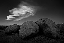 A Lenticular cloud formation or know locally as a 'Sierra Wave' which often forms over the Owens Valley in times of high winds before and after storms. Alabama Hills, California, USA, December 2009.