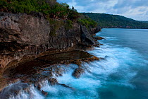 Waves crashing against rocky coastline at Martin Point, West coast of Christmas Island National Park, Indian Ocean, Australian Territory, November 2009.