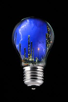 Lightning during thunderstorm above petrochemical industry inside incandescent lamp / bulb against black background. Digital composite