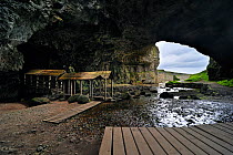Entrance of Smoo Cave with boardwalks, a large combined sea cave and freshwater cave in Durness in the Highlands, Scotland, UK, May 2010