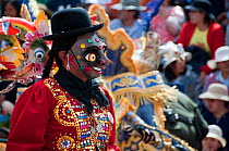 Masked costumes and dancers performing traditional dances in the streets, at the Oruro Carnival. This is the biggest annual cultural event in Bolivia, with Morenada music and dancing originating from...