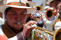 Portrait of trumpet player, during parade performance at the Oruro Carnival, the biggest annual cultural event in Bolivia, with Morenada music and dancing originating from the Bolivian Andes, Bolivia,...