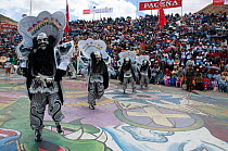 Oruro Carnival, dancers performing the traditional 'Diablada' dance, characterised by a mask and devil suit wore by the dancers.This is the biggest annual cultural event in Bolivia, with Morenada musi...