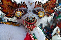 Oruro Carnival, portrait of dancer wearing ornamental mask used in the performance traditional 'Diablada' dances. This is the biggest annual cultural event in Bolivia, with Morenada music and dancing...