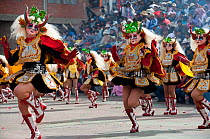 Oruro Carnival, masked female dancers wearing ornamental costumes used in the performance traditional 'Diablada' dances. This is the biggest annual cultural event in Bolivia, with Morenada music and d...