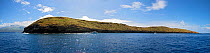 Molokini Island Marine Preserve with the Kihei/Makena shoreline of Maui in the background, Maui, Hawaii.
