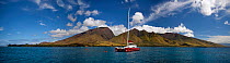Catamaran moored at Olowalu, a favourite site for snorkeling, off the West Maui Mountains, Hawaii.