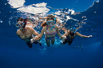 People free diving off the island of Lanai, Hawaii. Model released.