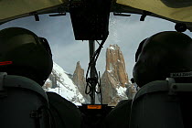 Rear view of pilots and Trango towers in the Karakoram Mountains, Himalayas, Pakistan, from Pakistani military helicopter, for BBC series Planet Earth. April 2005