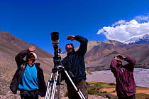 Cameraman Barry Britton with local guides searching for migrating Demoiselle Cranes  (Anthropoides virgo) in the Kali Gandaki Valley, Nepal, for BBC Planet Earth series, 2005