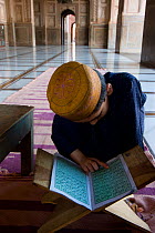 Boy studying Koran inside Mosque, Lahore, Pakistan, 2006