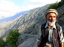 Portrait of local tracker working with film crew on location for BBC Planet Earth series, Mountains episode, 2005