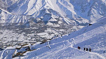 Film crew walking out of mountains down into Chitral valley after filming Snow leopard (Panthera uncia) Hindu Kush, Pakistan. For BBC Planet Earth series, Mountains episode, 2005