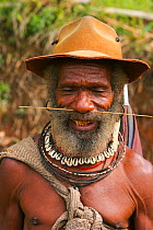 Portrait of Huli tribesman who helped film crew film Birds of Paradise, Papua New Guinea. Filming for BBC Planet Earth, Jungles episode, 2005