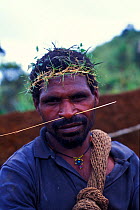 Portrait of Huli tribesman who helped film crew film Birds of Paradise, Papua New Guinea. Filming for BBC Planet Earth, Jungles episode, 2005