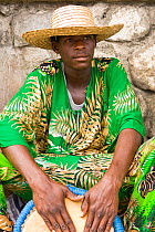 Portrait of street musician playing for cruise passengers. Roseau, Dominica, West Indies, Caribbean. July 2008. Model released