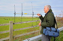 RSPB volunteer Peter Broxholme radiotracking Common / Eurasian cranes (Grus grus) released by the Great Crane Project onto the Somerset Levels and Moors. Somerset, UK, October 2010. 2020VISION Book Pl...