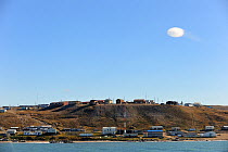 Coastal view of Pond Inlet Village, with circular cloud, Baffin Island, Nunavut, Canada, August 2010