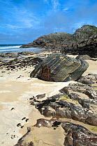 Lewisian metamorphic rocks eroded by sea on beach, Isle of Coll, Scotland, June