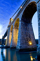 Thomas Telford's Menai or Britania Bridge over the Menai Straights at dawn, Gwynedd, Wales, December 2009.