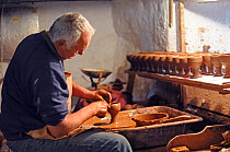Potter making traditional clay goblets, Cornwall, UK, May 2010