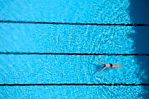 Aerial view of woman swimming in pool in Guangzhou, China.