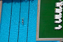 Aerial view of woman swimming in pool in Guangzhou, China.