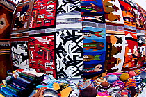 Handmade weavings for sale in a large Indian market in the town of Otavalo, Ecuador.