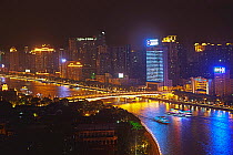 Dinner cruise vessels on Zhujiang River at night. Guangzhou, Guangdong, China. Digitally composed.