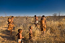 Kalahari bushmen, family looking for food in the bush during the dry season, Central Kalahari Desert, Botswana, August 2008