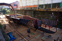 Replica of the Medway Queen, the last estuary pleasure paddle steamer in the UK, under construction in the Albion drydock, Bristol, England, April 2010. Property released.