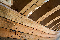 Hull detail of wooden cutter under construction at the Underfall Yard, Bristol, England, April 2010.