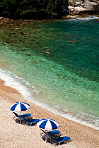Aerial view of swimmer off Pipitos beach, northern Corfu, Greece, June 2010.