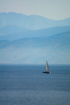 Yacht sailing in the straits between northern Corfu, Greece, and Albania, June 2010.