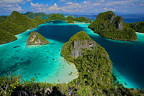 Aerial view of the Wayag Islands, an uninhabited group of uplifted limestone (karst) islands, NW of Waigeo Island. West Papua, Indonesia, April 2007